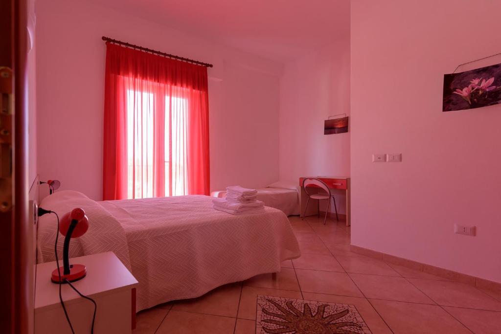 Postel nebo postele na pokoji v ubytování B&B Rose Villa
