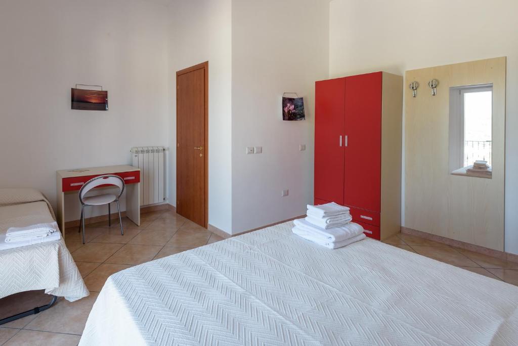 Postel nebo postele na pokoji v ubytování B&B Rose Villa