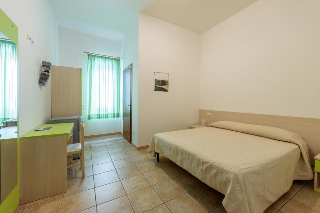 Postel nebo postele na pokoji v ubytování B&B Rose Villa