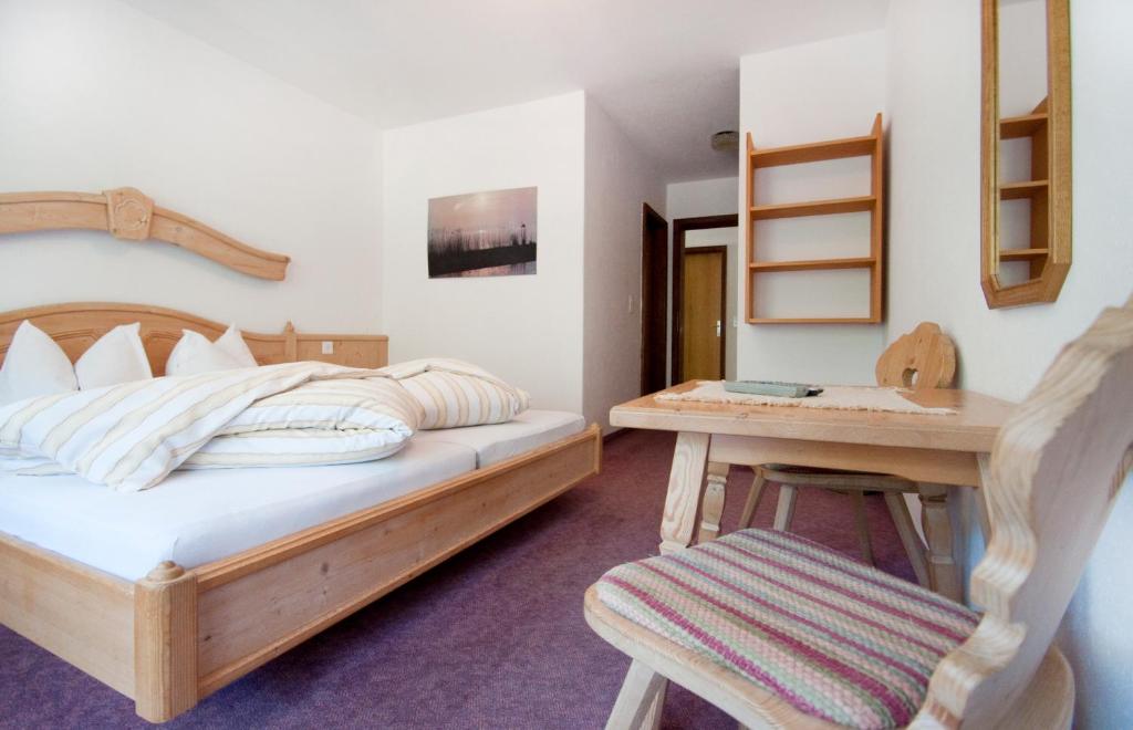 Postel nebo postele na pokoji v ubytování Garni-Appartement Collina