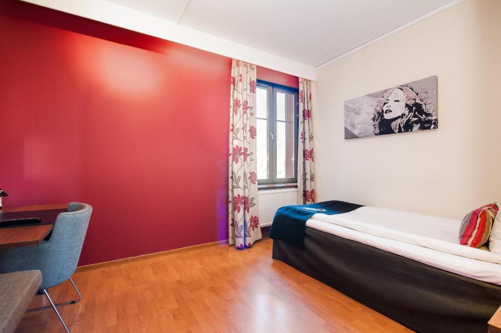 Postel nebo postele na pokoji v ubytování Home Hotel Kung Oscar