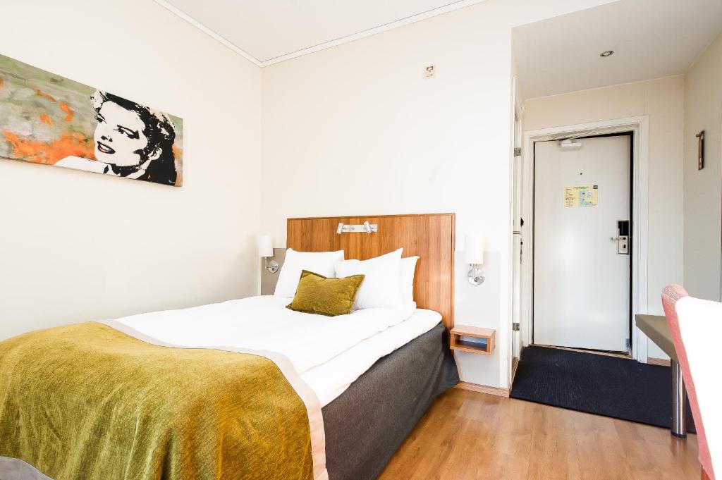 Postel nebo postele na pokoji v ubytování Home Hotel Kung Oscar