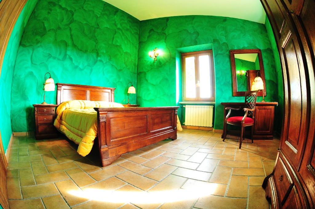 Postel nebo postele na pokoji v ubytování Poggio dei cavalieri