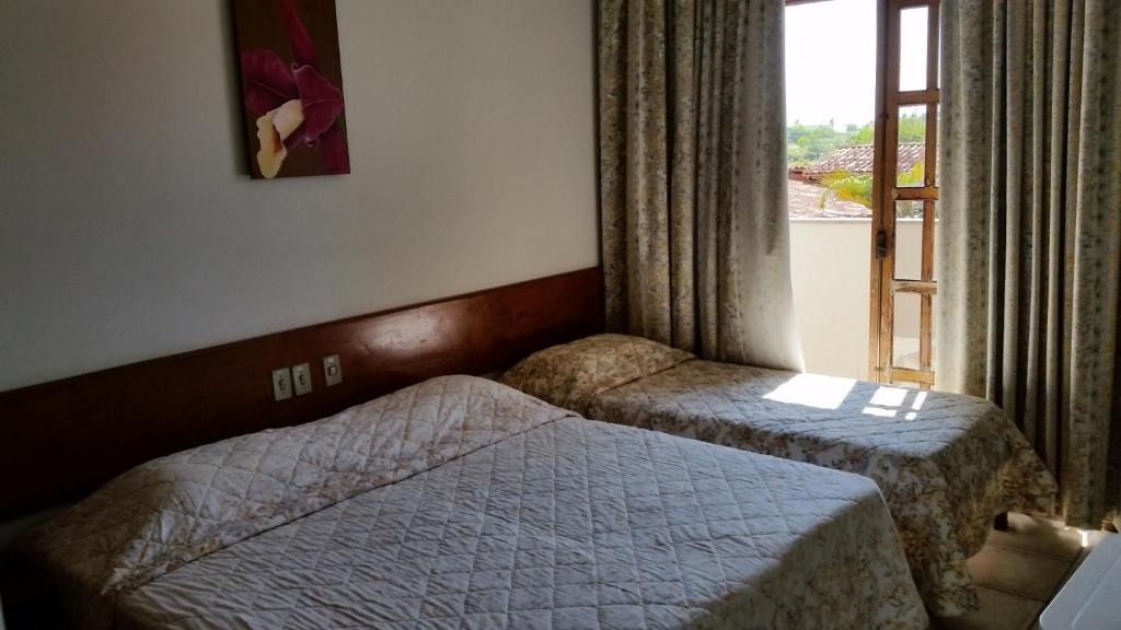 Postel nebo postele na pokoji v ubytování Quiriri Park Hotel