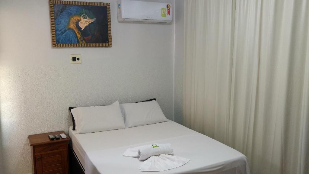 Säng eller sängar i ett rum på Hotel Manzoni