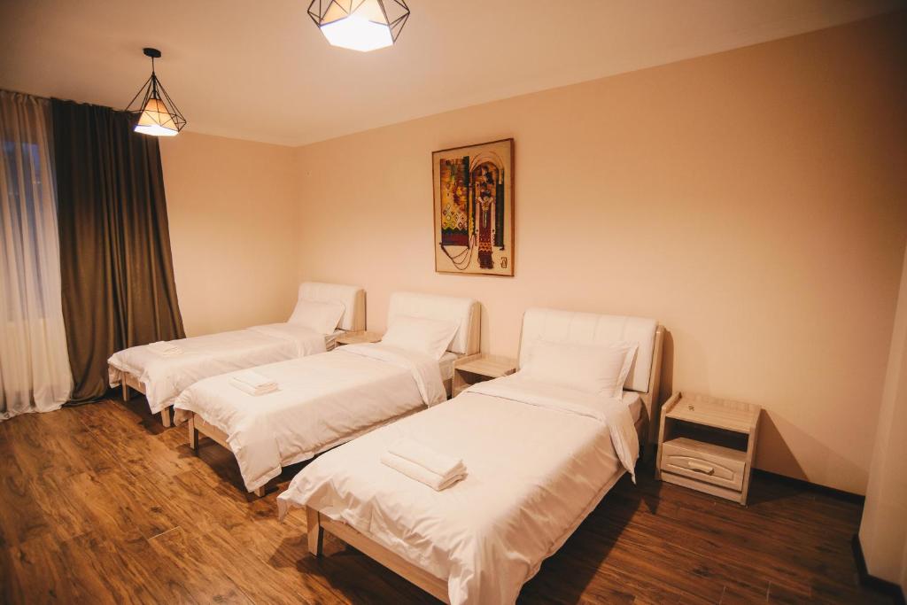 Postel nebo postele na pokoji v ubytování Hotel Sani Kutaisi