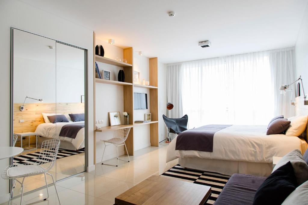Postel nebo postele na pokoji v ubytování Lemon Suites