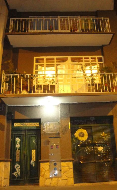 a building with a balcony on the top of it at La Casa Cuencana in Cuenca