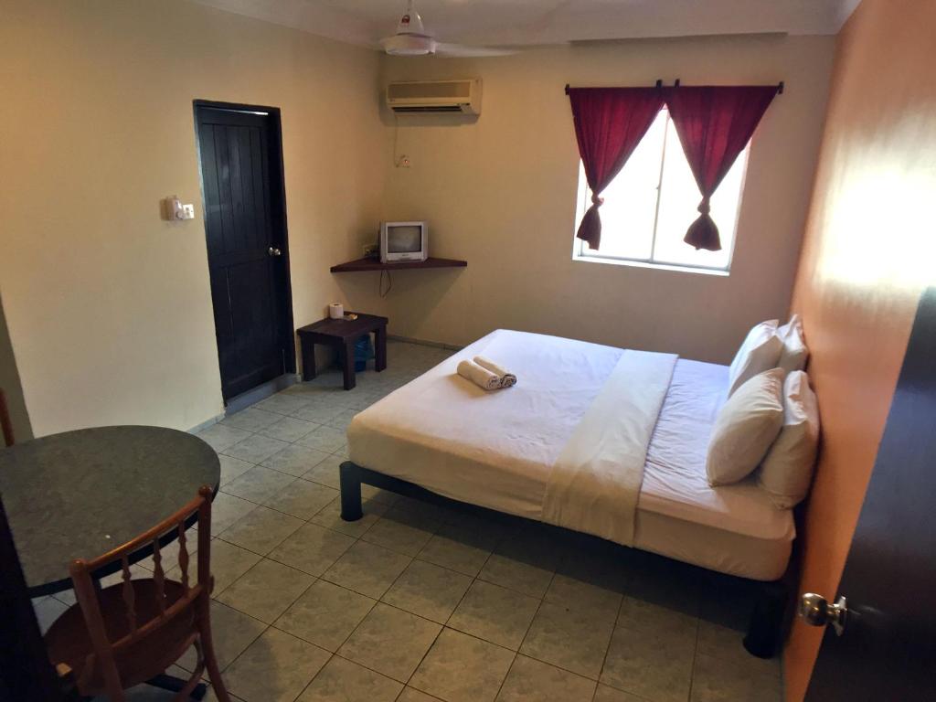 Postel nebo postele na pokoji v ubytování Abell Residence