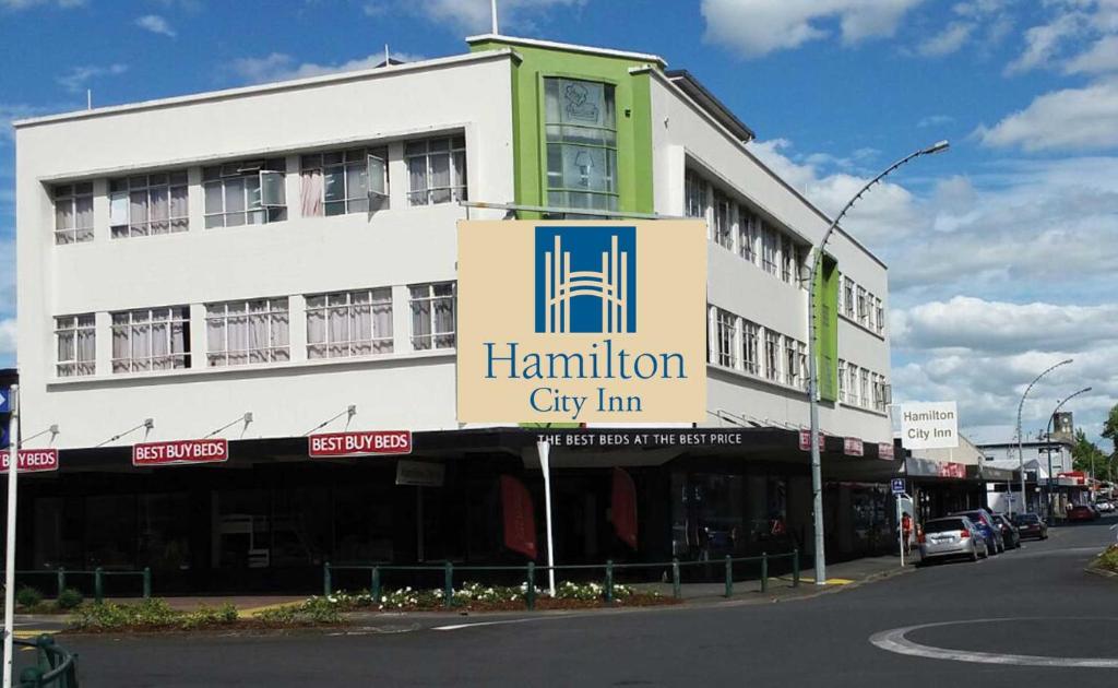 a building with a sign for a hamilton city inn at Hamilton City Inn in Hamilton