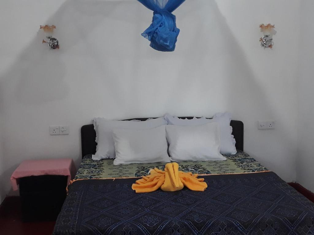 Postel nebo postele na pokoji v ubytování Deneth Homestay
