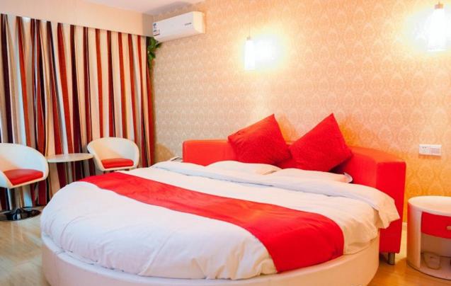 Postel nebo postele na pokoji v ubytování Thank Inn Chain Hotel Jiangsu Nantong Haimen Jiefang East Road