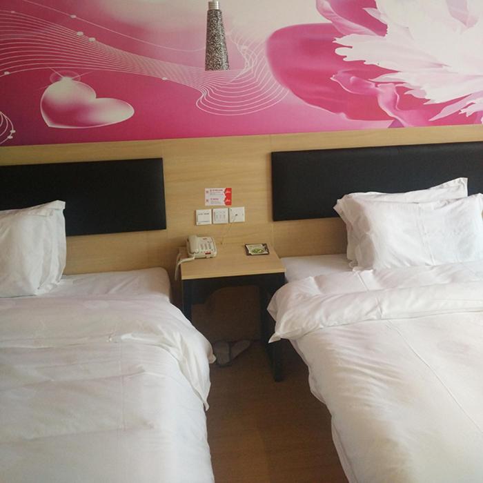 Rúm í herbergi á Thank Inn Plus Hotel Jiangsu Taizhou Xinghua Anfeng Town