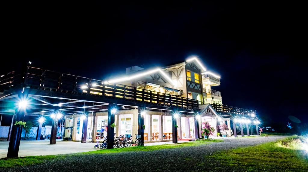 a building with lights on it at night at Fully One B&amp;B in Taitung City