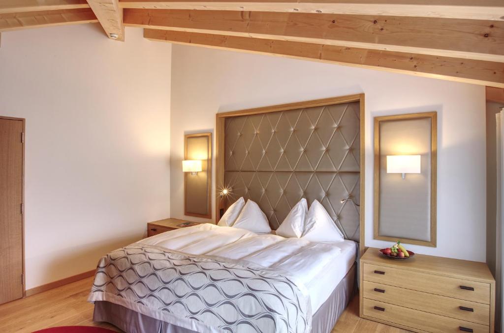 Postel nebo postele na pokoji v ubytování Hotel Alte Post Bonaduz
