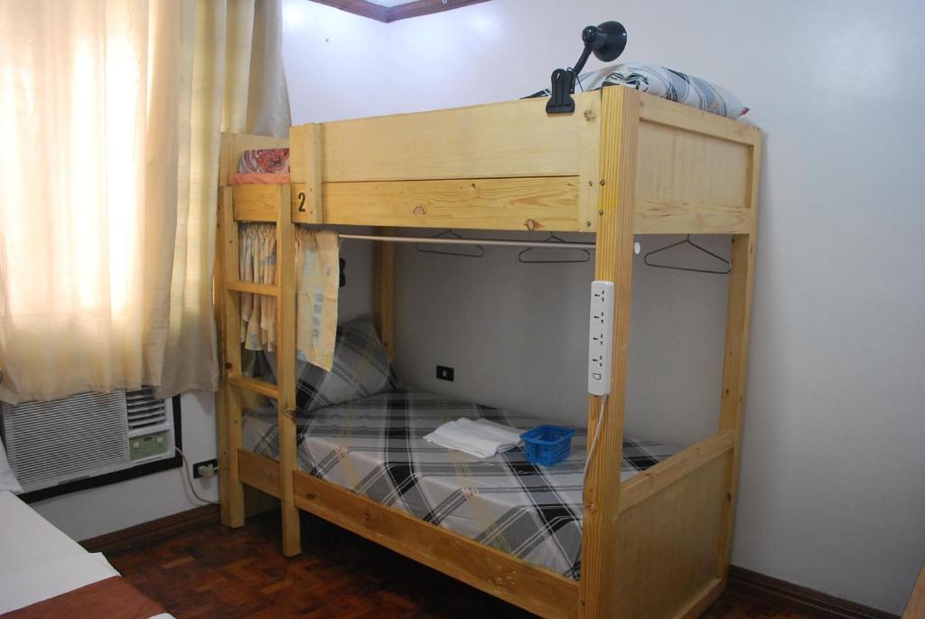 Postel nebo postele na pokoji v ubytování Spacious Low Rise Condo