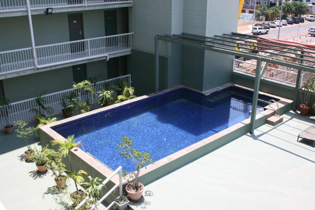an overhead view of a swimming pool on a building at Luma Luma Holiday Apartments in Darwin