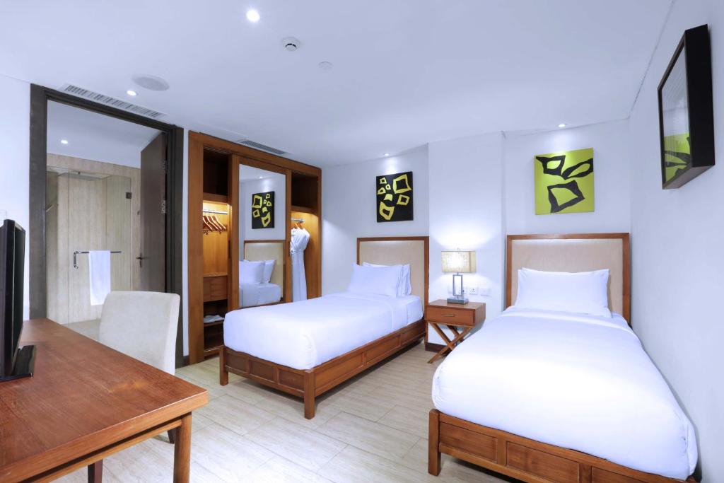 Postel nebo postele na pokoji v ubytování Lv8 Resort Hotel