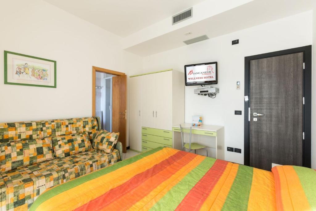 Postel nebo postele na pokoji v ubytování Hotel Biancaneve Wellness