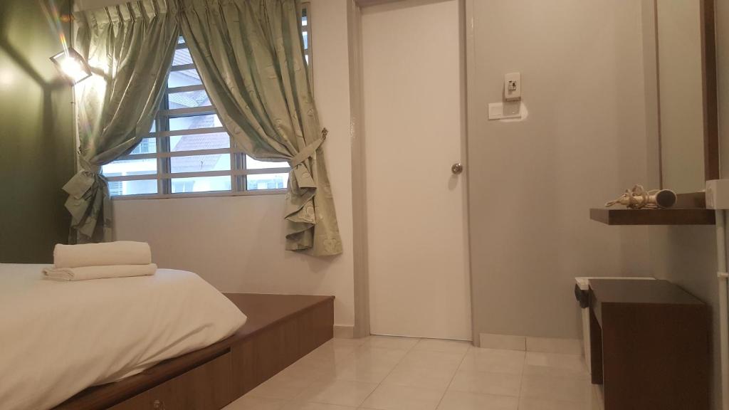Postel nebo postele na pokoji v ubytování Tulip Hotel