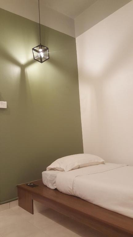 Postel nebo postele na pokoji v ubytování Tulip Hotel