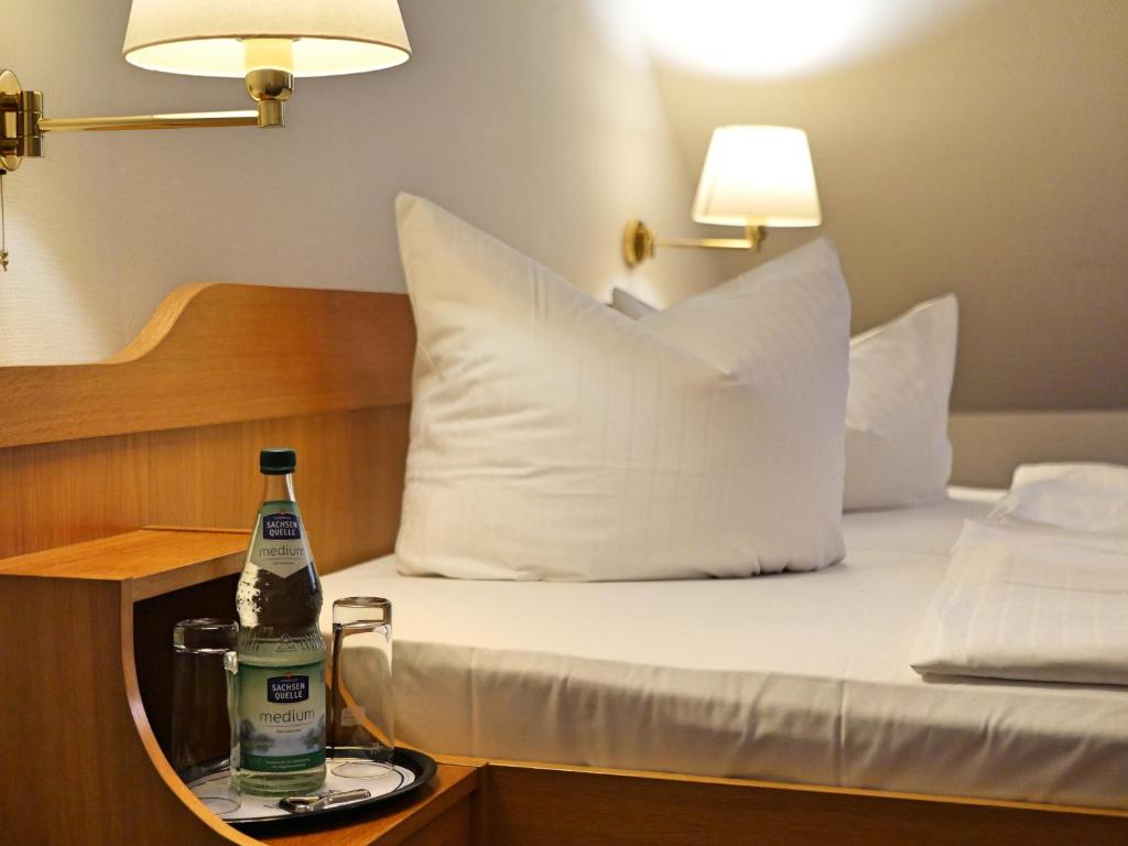 Postel nebo postele na pokoji v ubytování Central-Hotel Torgau