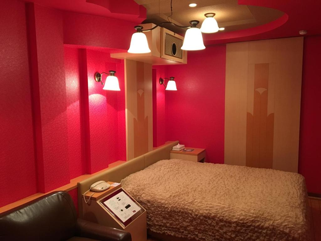 Postel nebo postele na pokoji v ubytování Hotel Charbon (Adult Only)