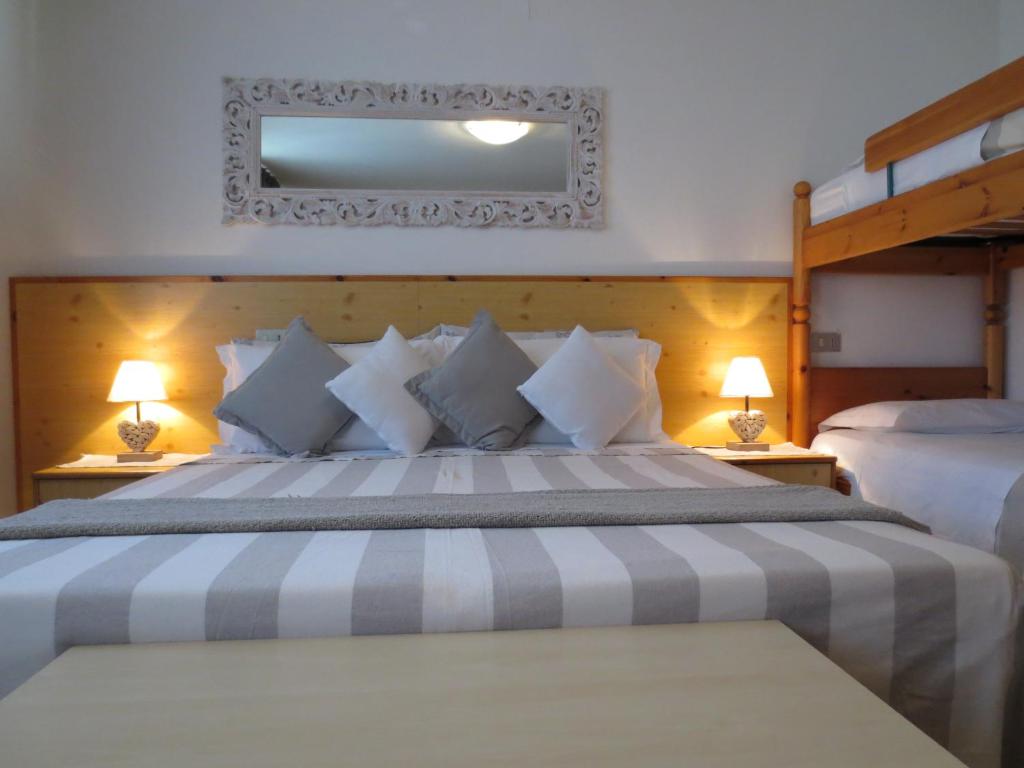 Postel nebo postele na pokoji v ubytování Hotel Aurora