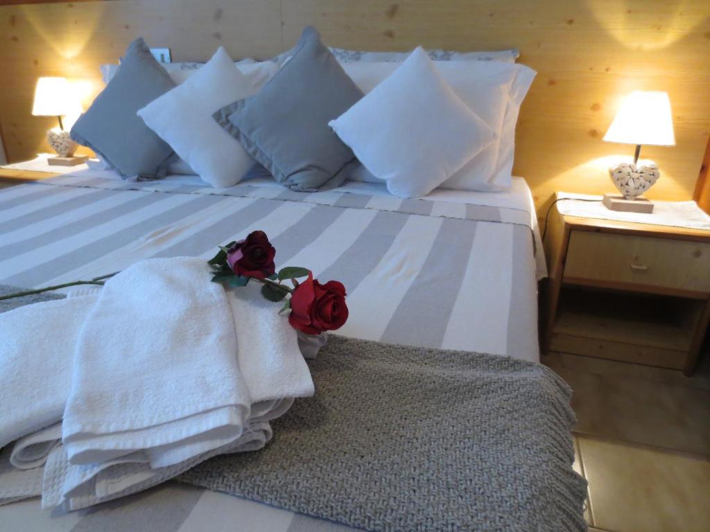 Postel nebo postele na pokoji v ubytování Hotel Aurora