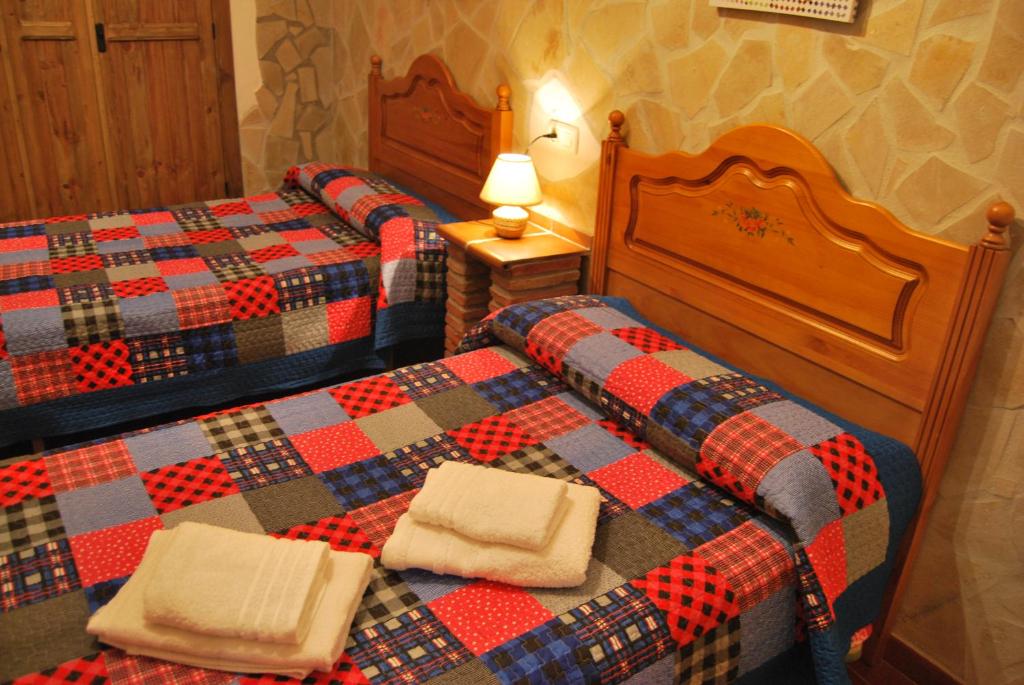 Postel nebo postele na pokoji v ubytování Cueva El Jaraiz