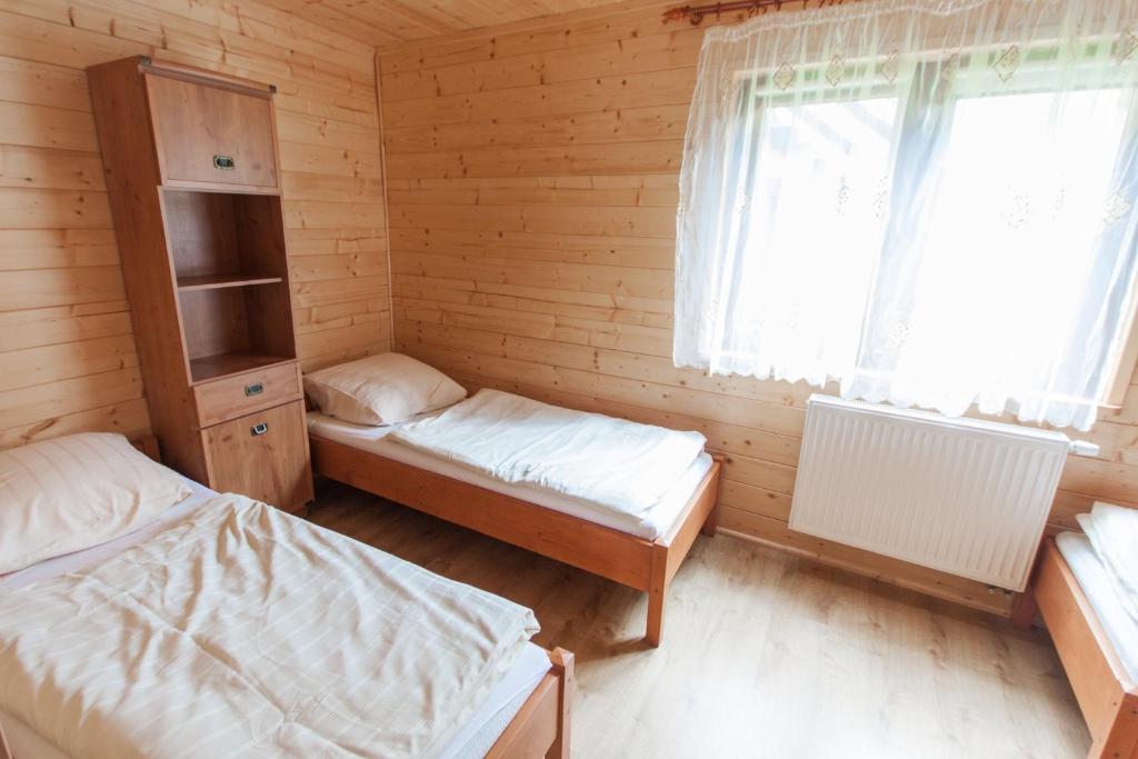 Postel nebo postele na pokoji v ubytování Ośrodek Wypoczynkowy "u Krzysia"
