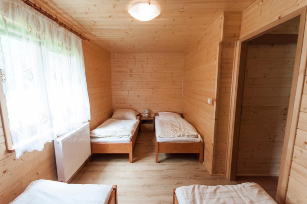 Postel nebo postele na pokoji v ubytování Ośrodek Wypoczynkowy "u Krzysia"