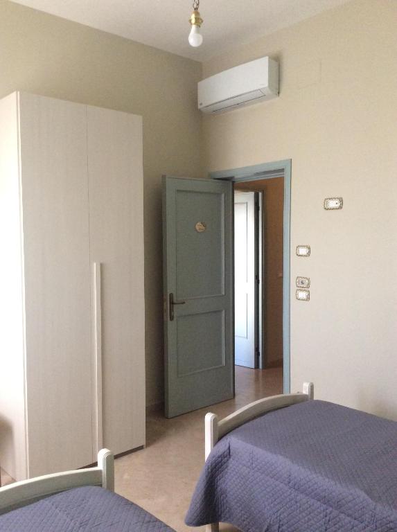 Łóżko lub łóżka w pokoju w obiekcie ZeroSalento Casa Vacanze