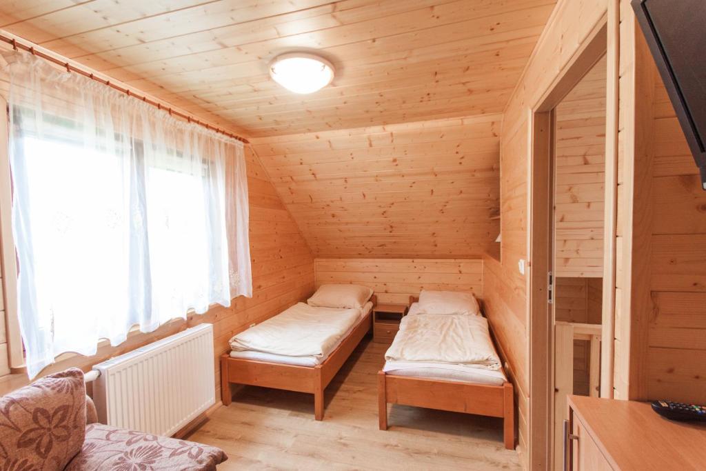 Postel nebo postele na pokoji v ubytování Ośrodek Wypoczynkowy "u Krzysia"