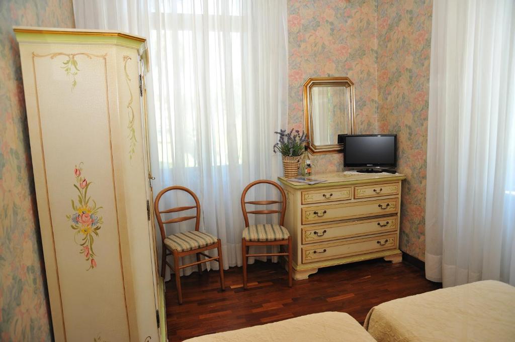Postel nebo postele na pokoji v ubytování Hotel Savona