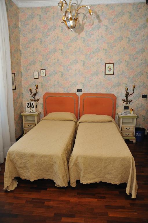 Postel nebo postele na pokoji v ubytování Hotel Savona