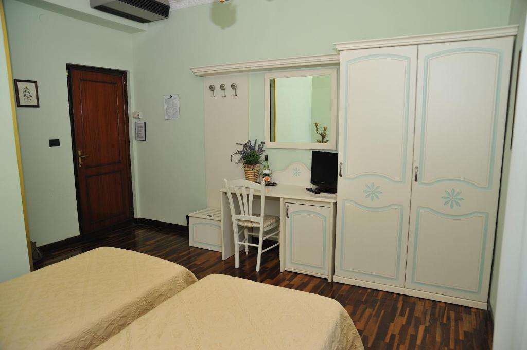 Postel nebo postele na pokoji v ubytování Hotel Savona