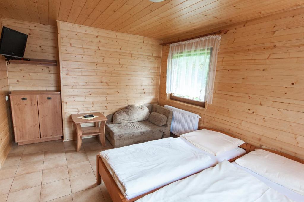 Postel nebo postele na pokoji v ubytování Ośrodek Wypoczynkowy "u Krzysia"