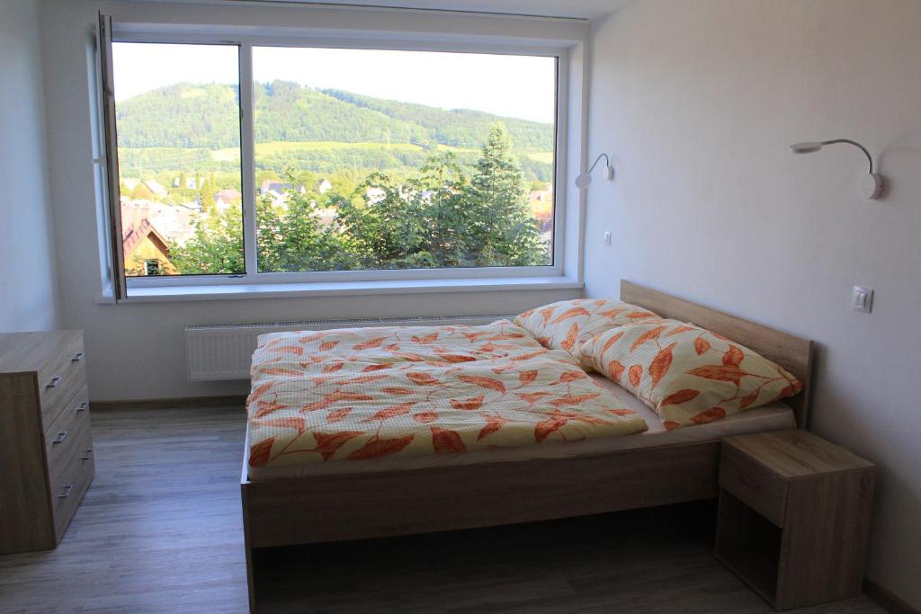 Postel nebo postele na pokoji v ubytování Vila Lom