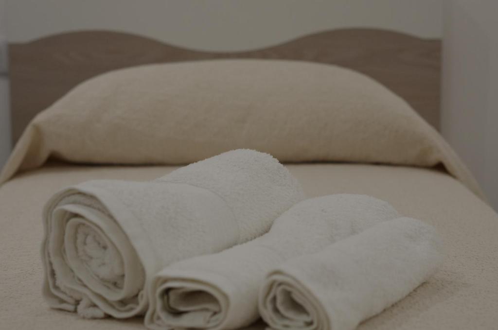 Postel nebo postele na pokoji v ubytování B&B Il più bello dei mari