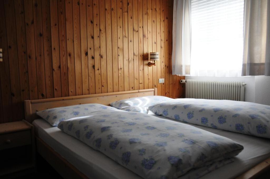 Postel nebo postele na pokoji v ubytování Ciasa Confolia