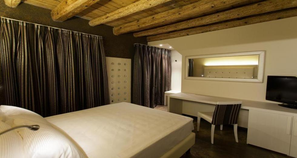 Postel nebo postele na pokoji v ubytování Villa Solaris Hotel & Residence