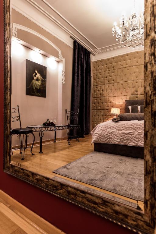 Postel nebo postele na pokoji v ubytování Ben Akiba Luxury Suites