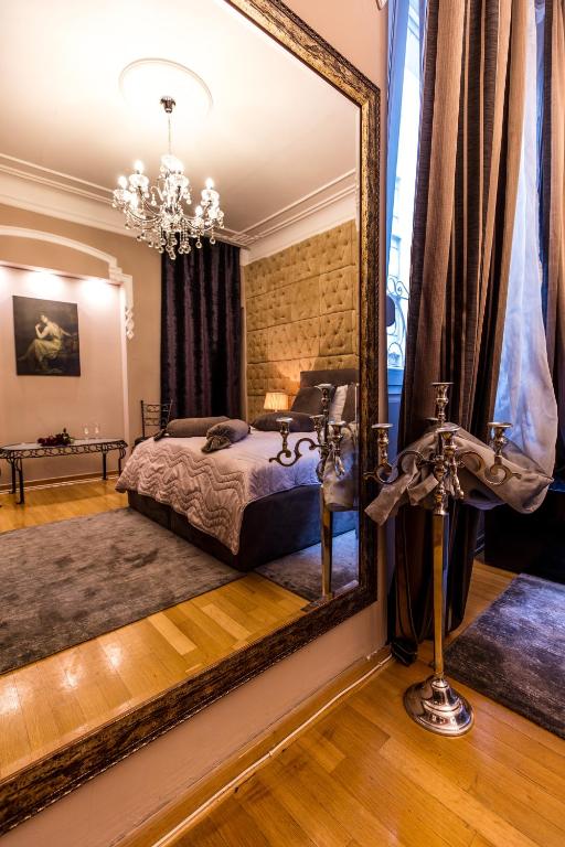 Postel nebo postele na pokoji v ubytování Ben Akiba Luxury Suites