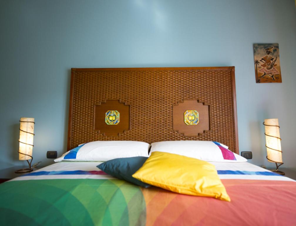 Postel nebo postele na pokoji v ubytování Dolce Conca D'Oro B&B