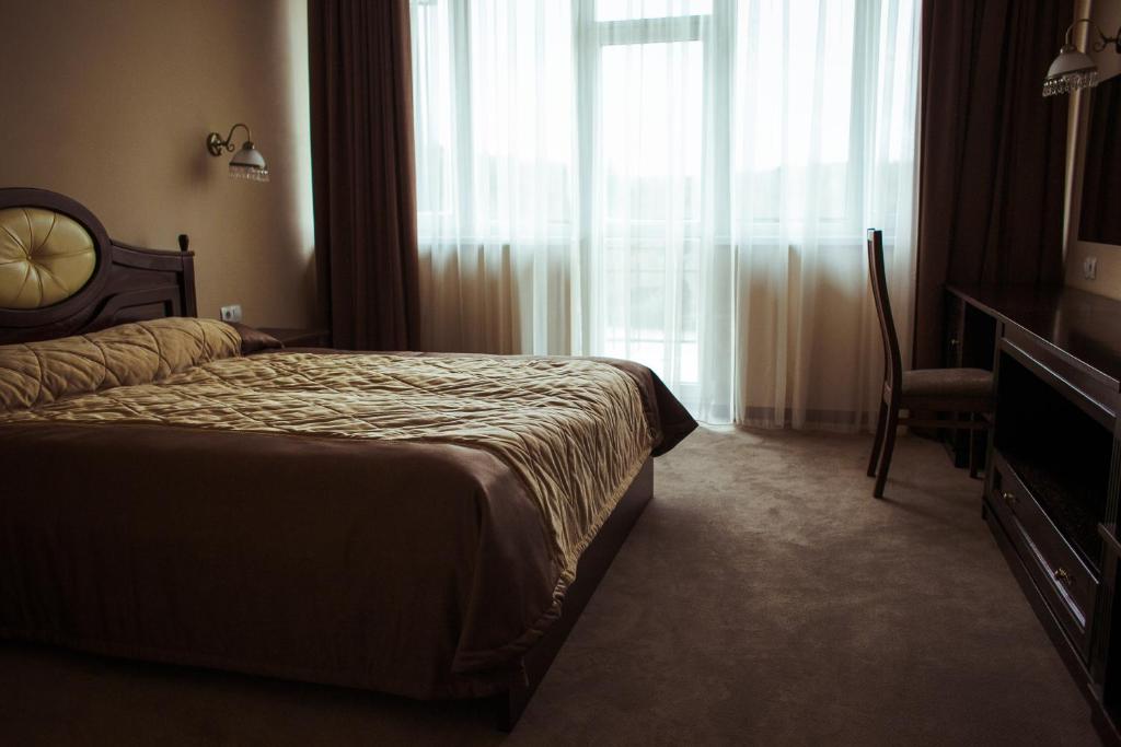 Postel nebo postele na pokoji v ubytování Warszawa Hotel