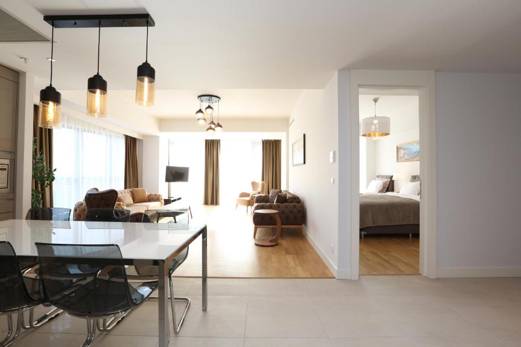 a living room and dining room with a dining table at Classy Suite Taksim in Istanbul