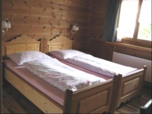 Postel nebo postele na pokoji v ubytování B&B Haus im Sand