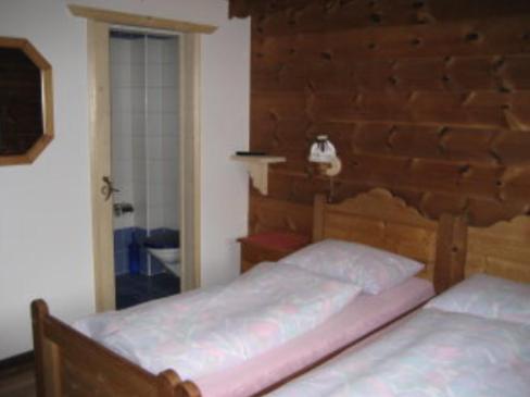 Postel nebo postele na pokoji v ubytování B&B Haus im Sand