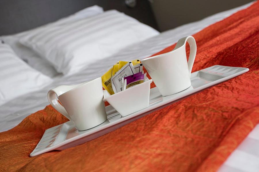 Postel nebo postele na pokoji v ubytování Zara Rooms & Suites